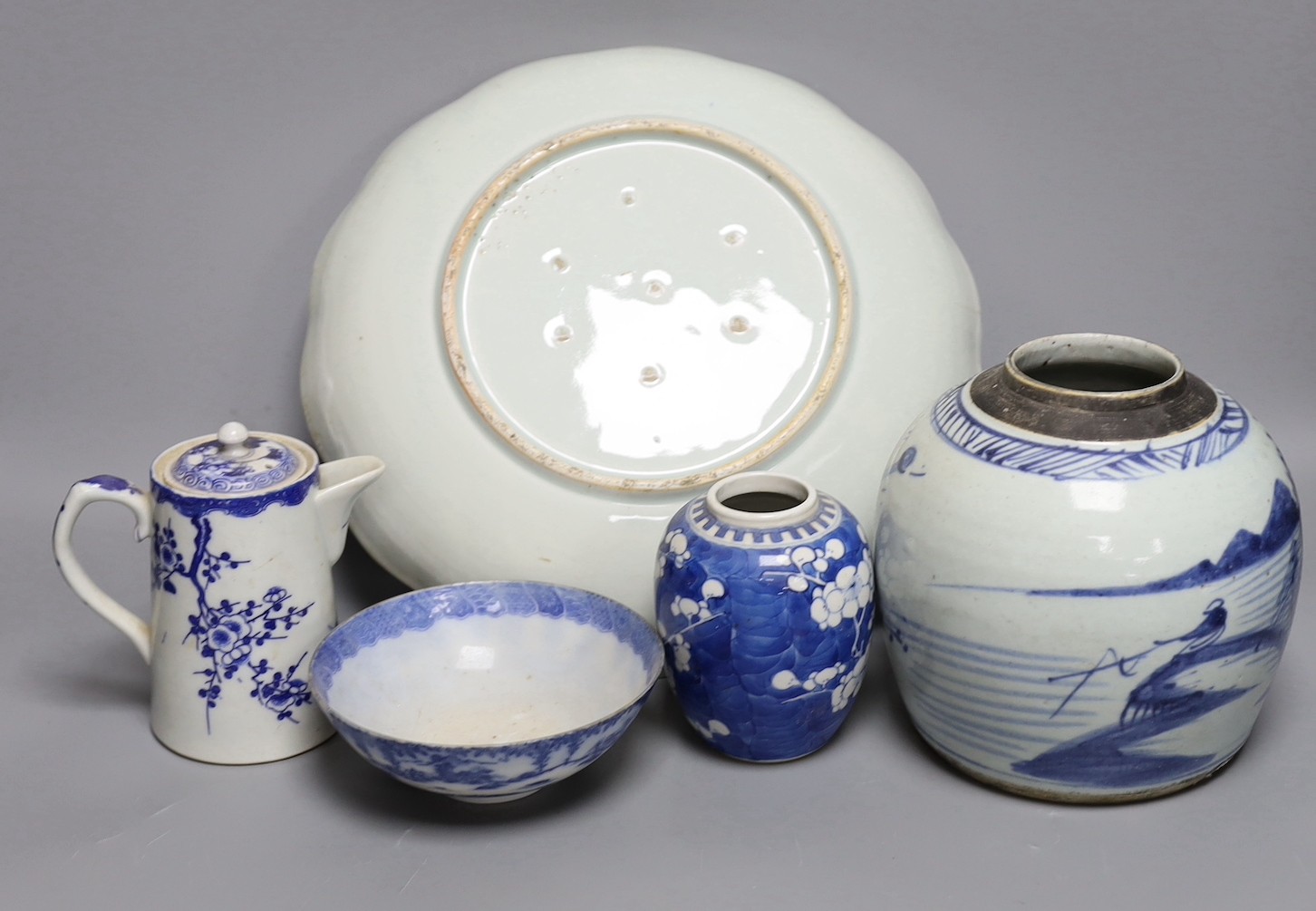 A Japanese Edo period blue and white dish, a Chinese Prunus blossom jar, late 19th century, a provincial blue and white jar and other items, dish 31 cms diameter